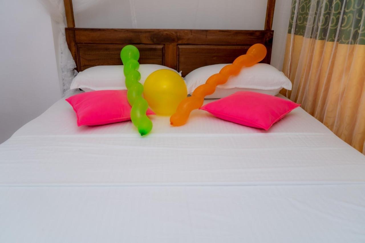Rainforest Holiday Inn เดนิยายา ห้อง รูปภาพ